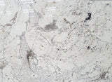 Granite Alaska White Premium  <br>Fini : Poli -  Lot : 4536  <br>Epaisseur : 1.25''  <br>Dimensions : +,- 109'' x 77'' <br> Indice de prix : $$$$<br> ARRIVAGE JANVIER 2027